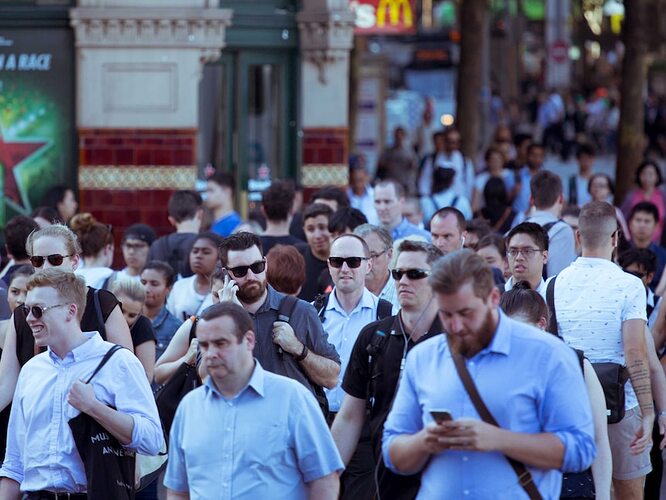 Pedestrians cross at Flinders Street