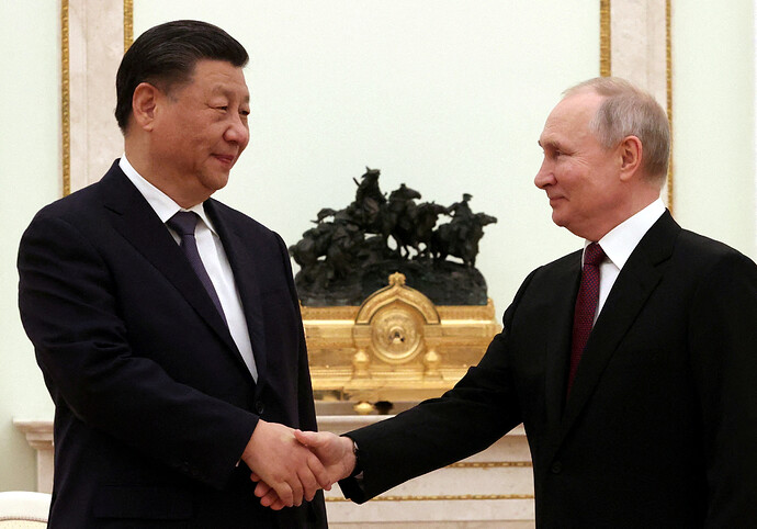 Putin meets 'dear friend' Xi in Kremlin as Ukraine war grinds on | Reuters